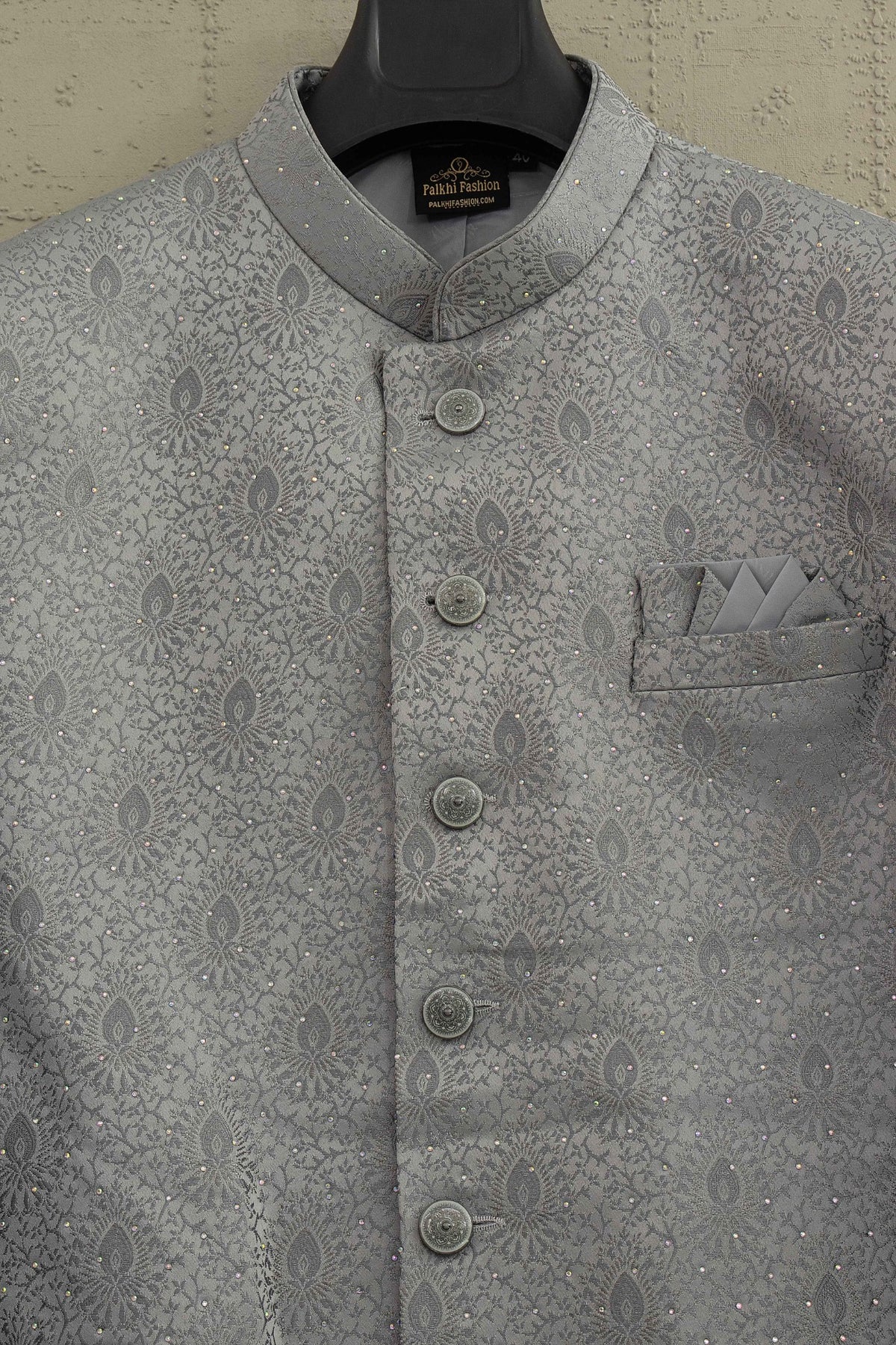 Close-up of grey jacquard Indo Western stone work and buttons